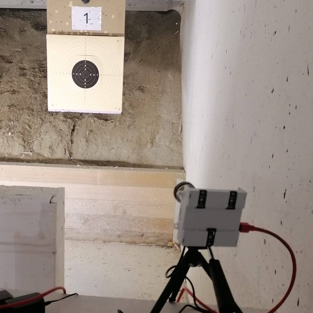 Fixed camera on a tripod beside the target on the range